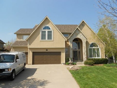 Exterior: Sherwin Williams Superpaint. Body: Latte, Trim: Universal Khaki and Accent color: Van Dyke Brown